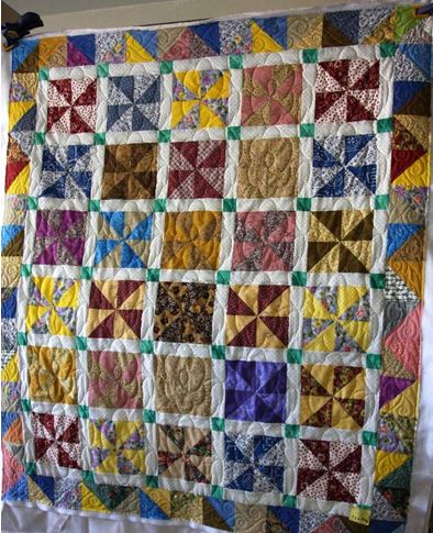 Quilt pieced by Faye Miller Long arm<br/>Quilted by Leslie Starks<br/>Binding by various club members
